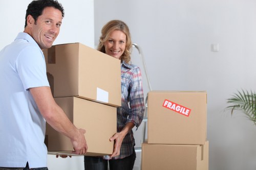 Professional movers handling furniture and packing for a Bayswater property